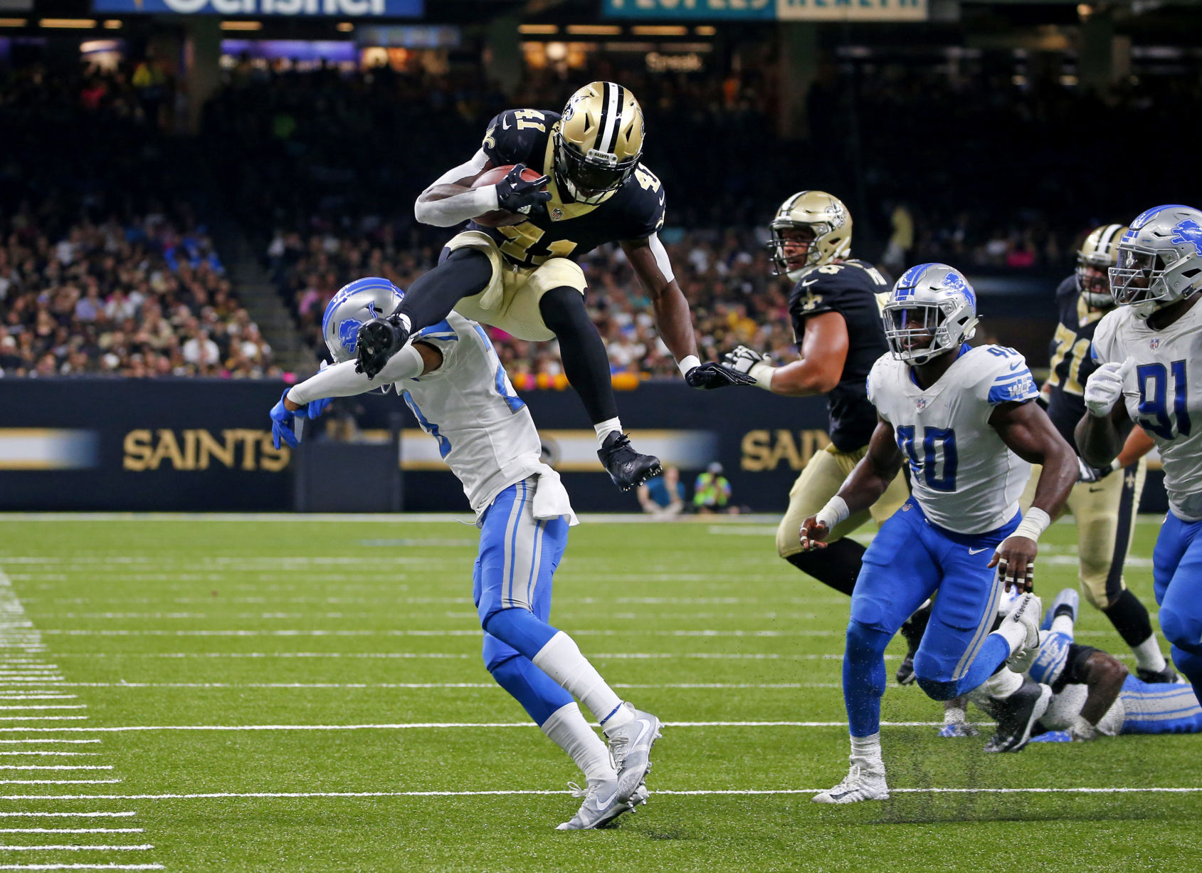 SECOND QUARTER - Alvin Kamara leaps over defender